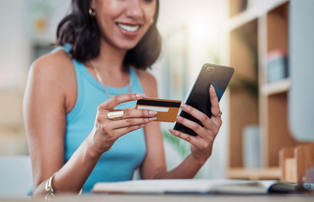 Online shopping phone banking and credit card for investing ordering or purchasing distance learning home course Freelance entrepreneur hands trading buying and paying for ecommerce startup order
