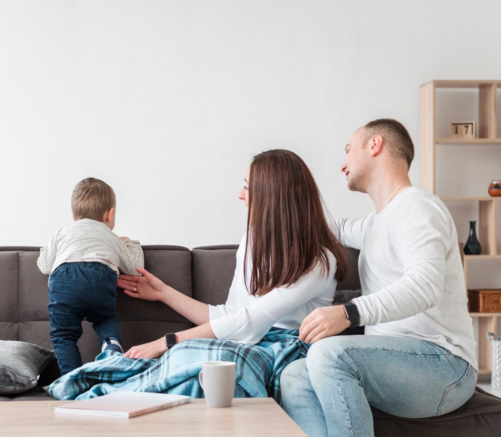 family at home with baby